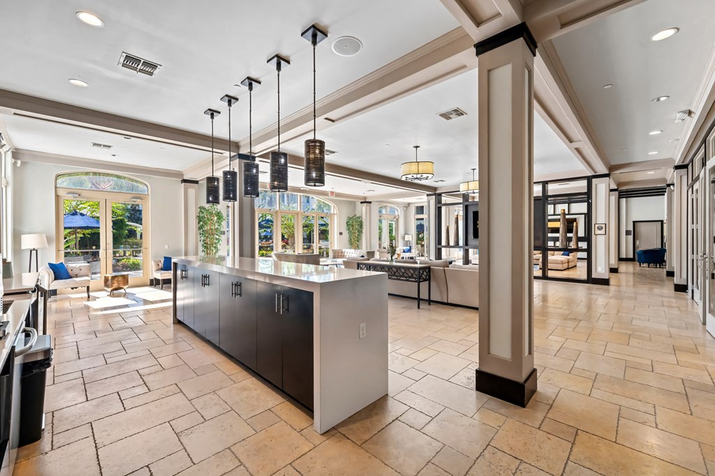 A kitchen with a large island in the middle of the room.