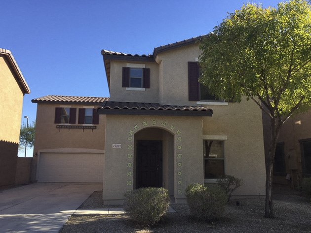 a house with a tree in front of it