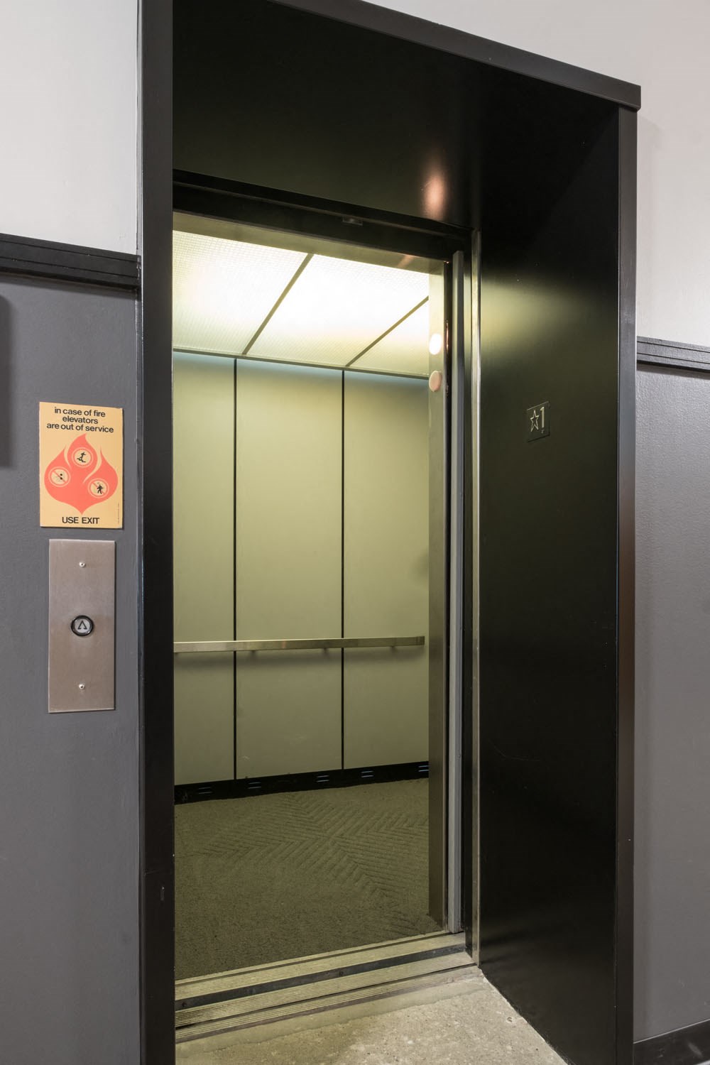 the door to an elevator in an office building