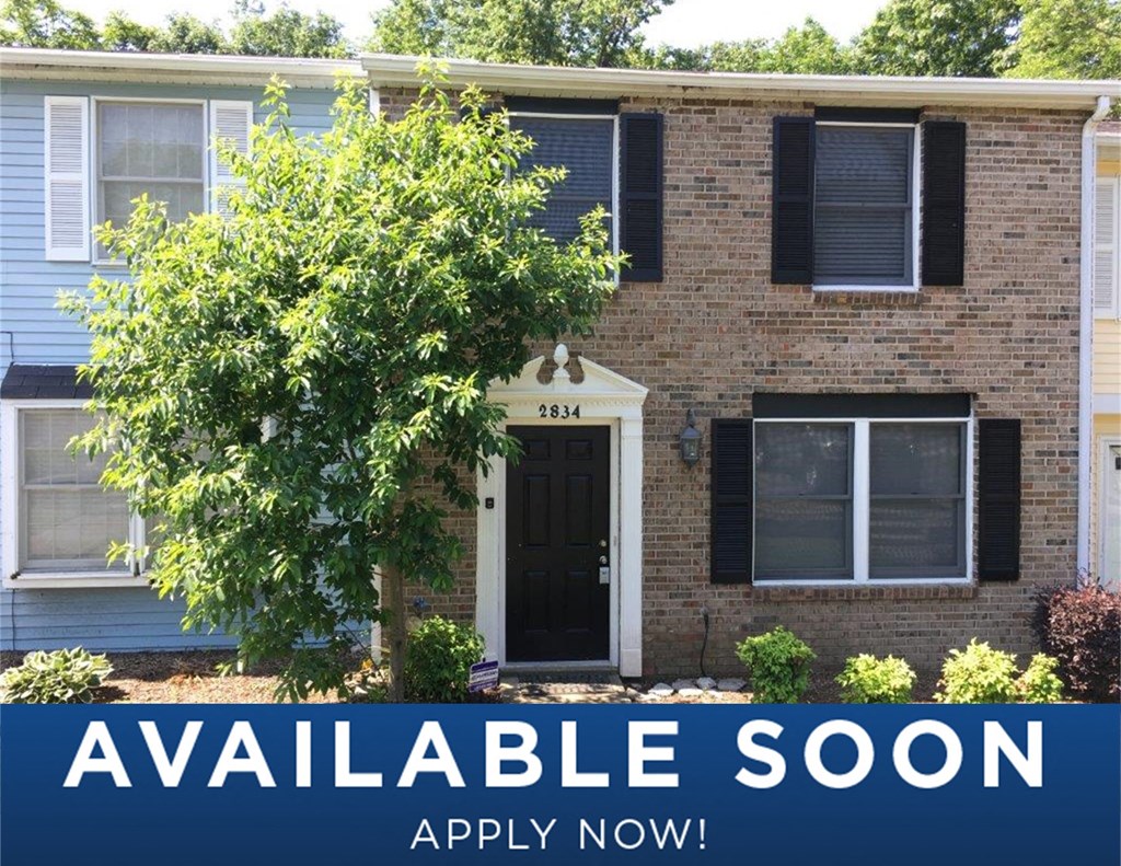 a house with a tree in front of it
