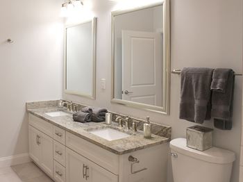 Double sink vanities in bathrooms at Residences at Halle, Cleveland, OH, 44113