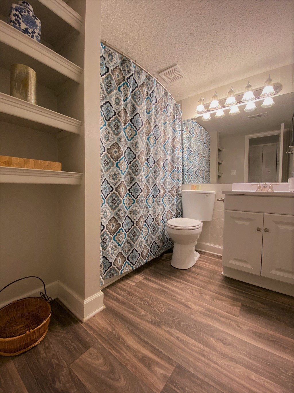 a bathroom with a shower and a toilet