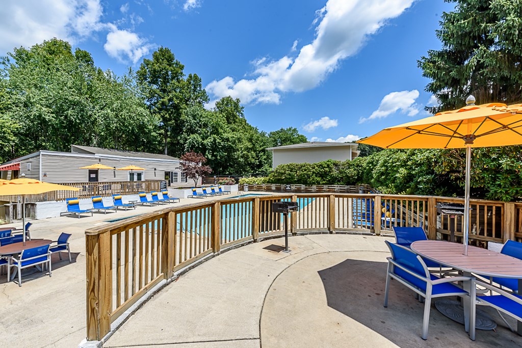 the pool at the preserve at polo terrace with umbrellas and chairs