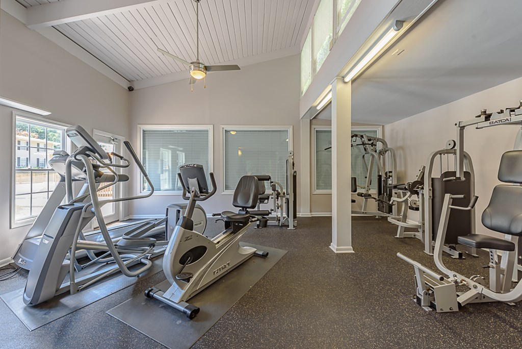 a gym with treadmills and other exercise equipment