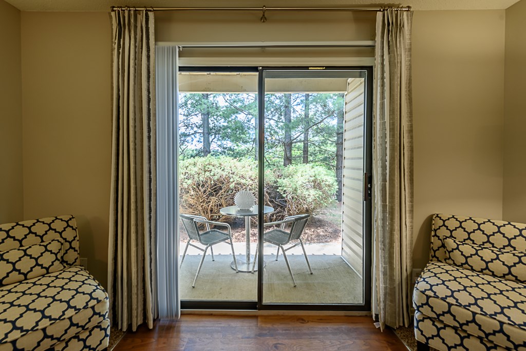 a living room with sliding glass doors to a patio