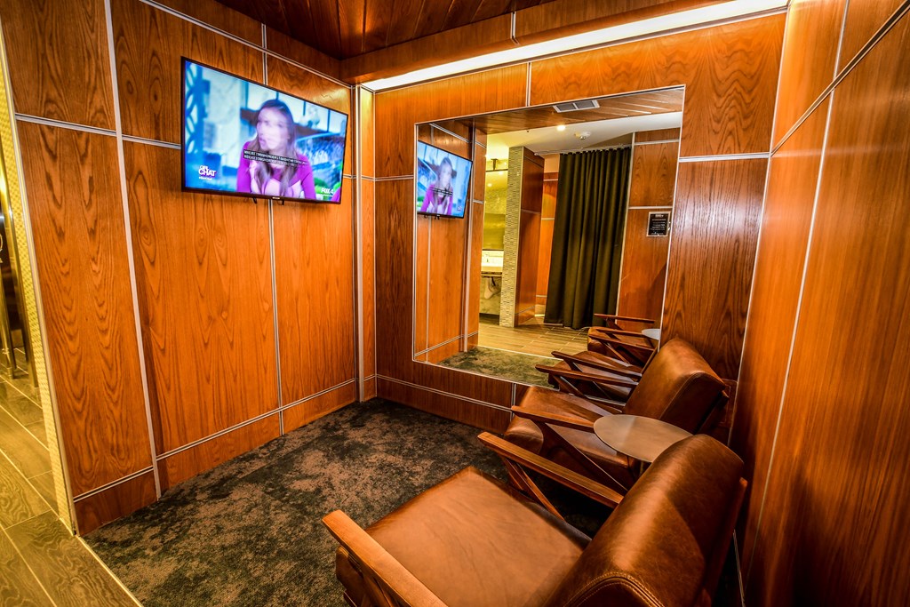 a conference room with chairs and a tv