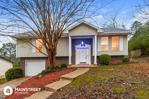 a house with a blue light on the front of it