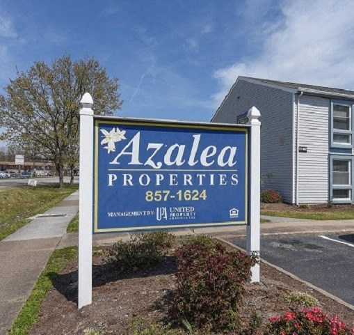 aadata properties sign in front of an apartment building