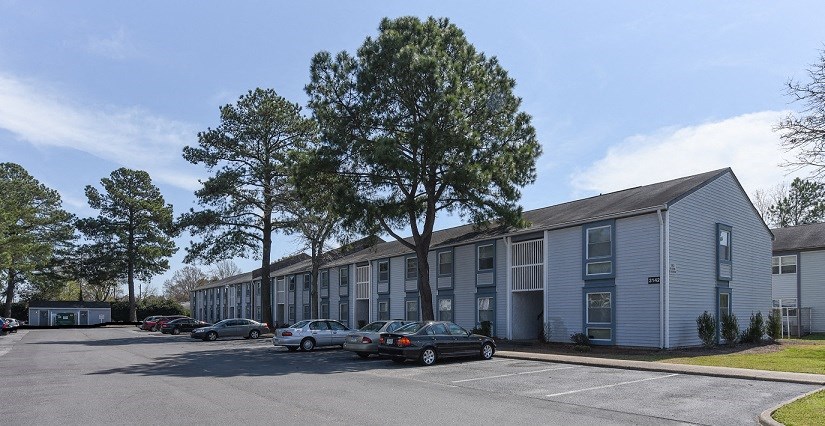 a building with cars parked in front of it
