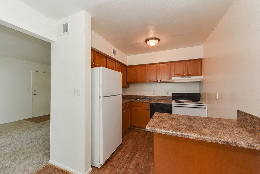 a kitchen with a refrigerator and a counter top