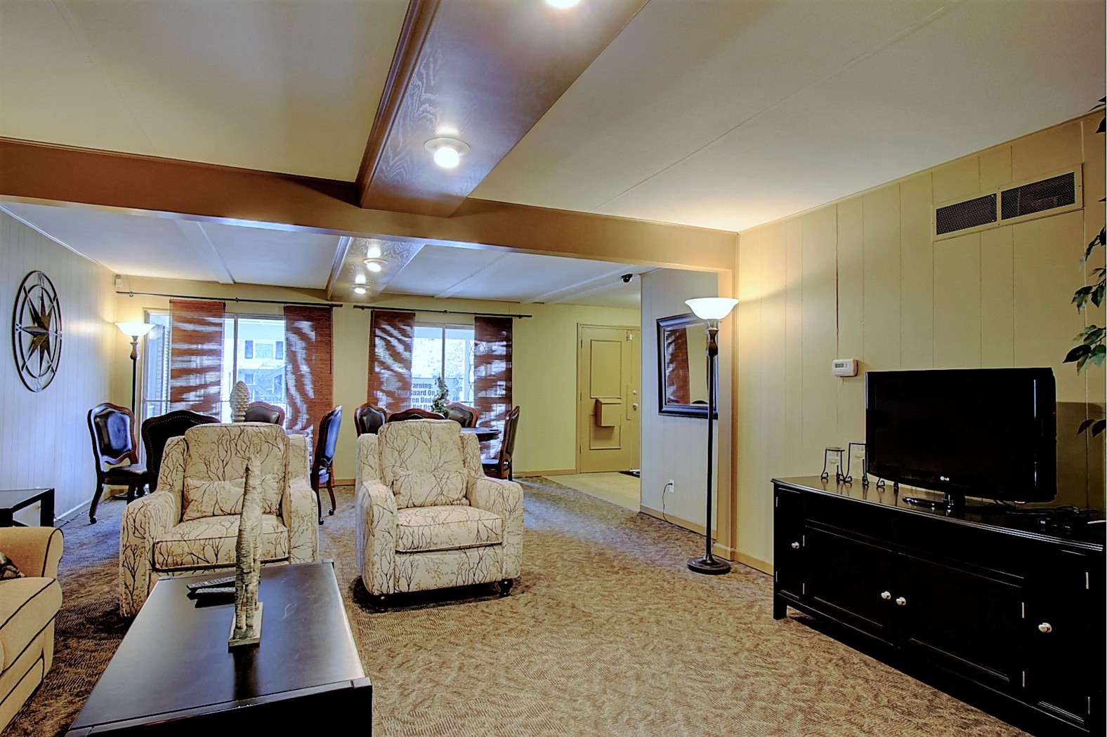 a living room with furniture and a television