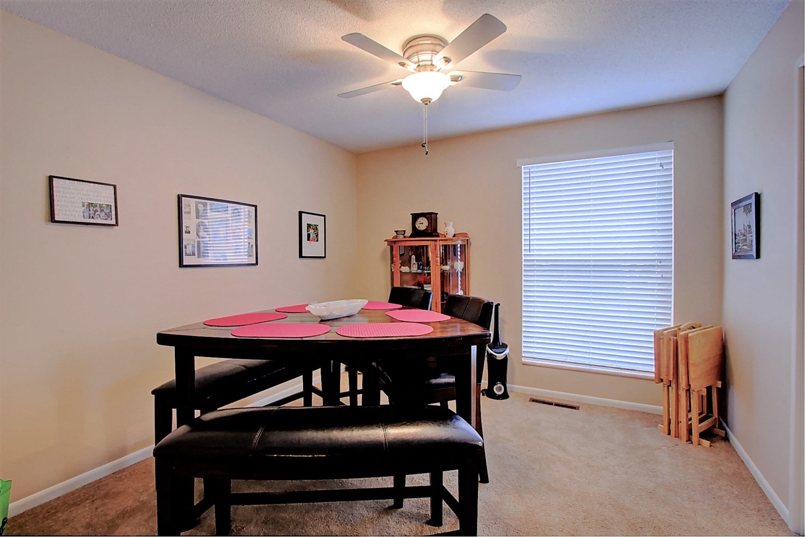 Image of dining room with table, chairs, and ceiling fan