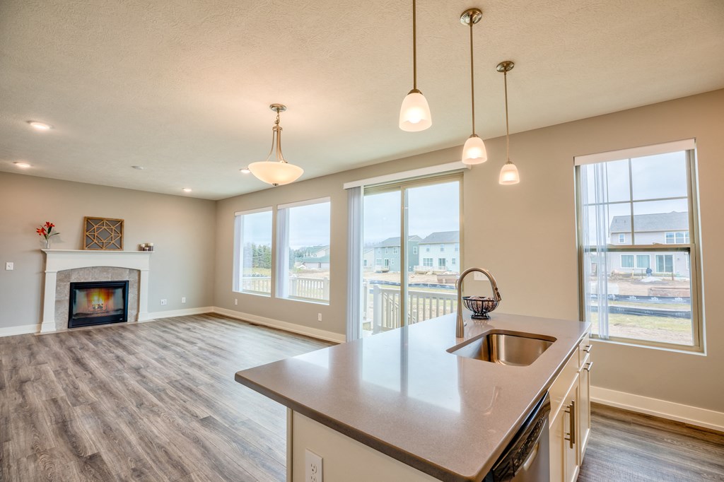 Kitchen and living room of Home For Rent in Holt Michigan | Aspen Lakes Estates