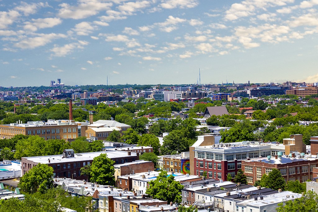 an aerial view of a city with buildings and trees