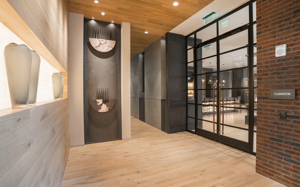the lobby of a building with a large glass door
