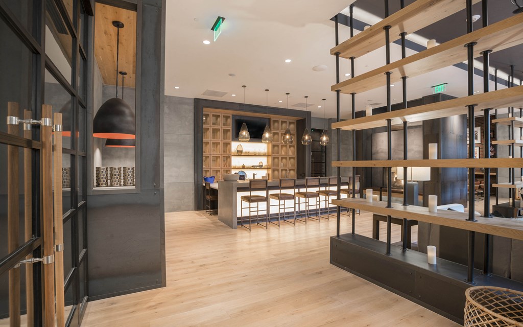 the interior of a restaurant with wooden floors and a large room with tables and chairs