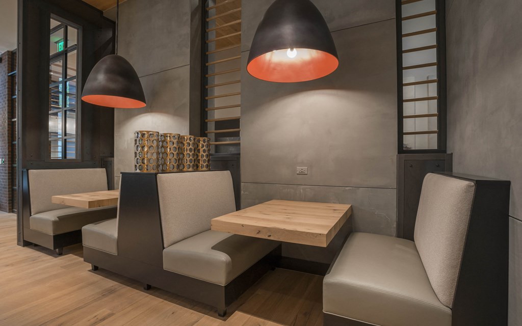 a small restaurant with chairs and tables and a wooden table