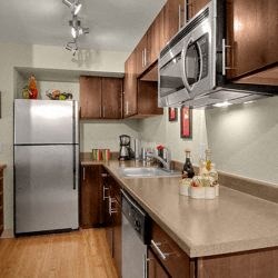 a kitchen with stainless steel appliances and a counter top