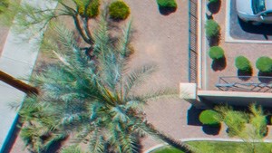 Aerial View of Sky P83 Leasing office and pool Overhead view of entryway into the community, showing rooftop of leasing office, and view of resort style pool