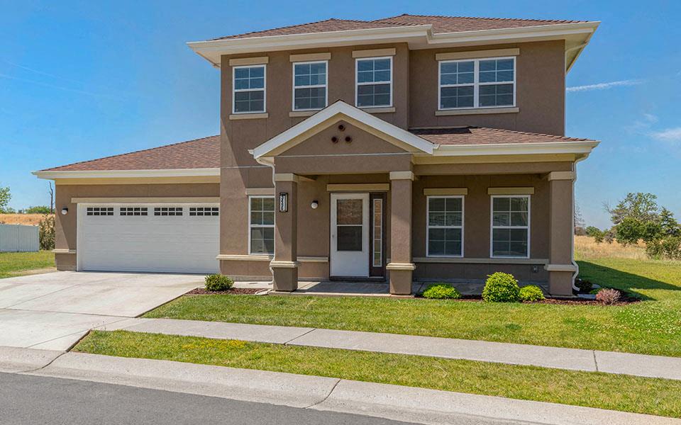 a house with a driveway and a garage door