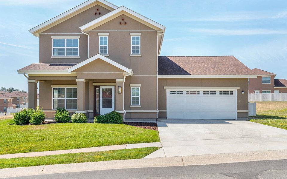 a house with a driveway and a garage door