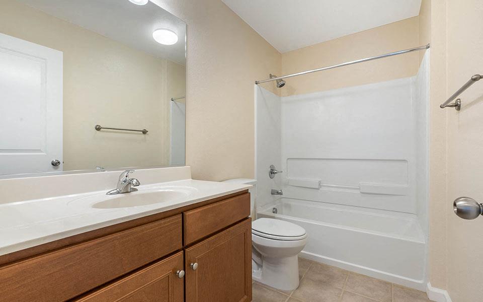 a bathroom with a sink toilet and a shower