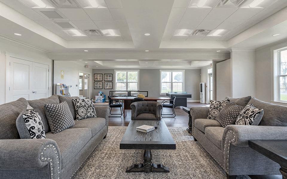 a living room with couches and a coffee table