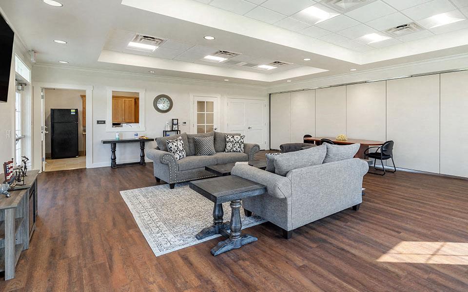 a living room with couches and a table