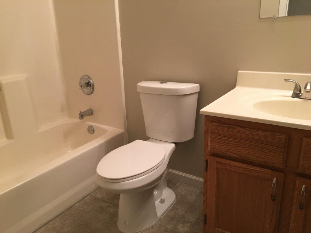 a bathroom with a toilet and a sink