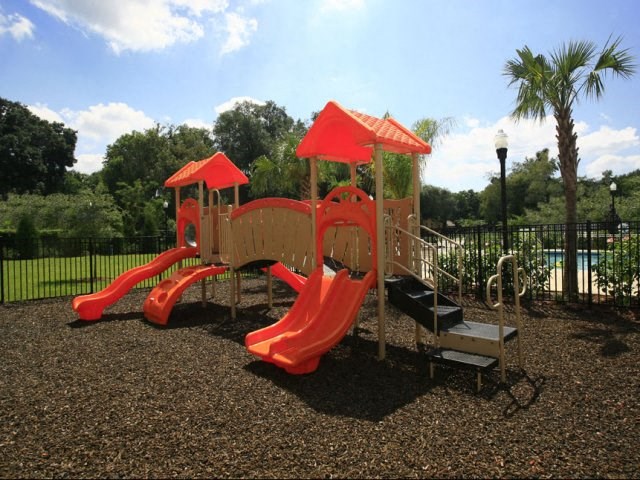 Playground with slides at Summerlin Oaks Apartments