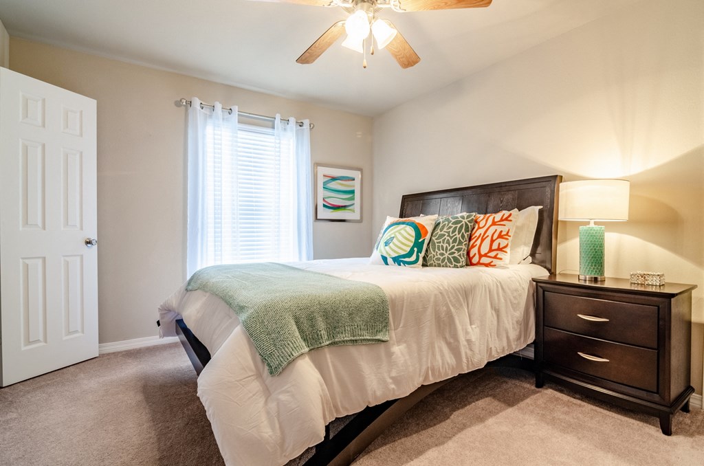 the reserve at city center spacious bedroom with ceiling fan
