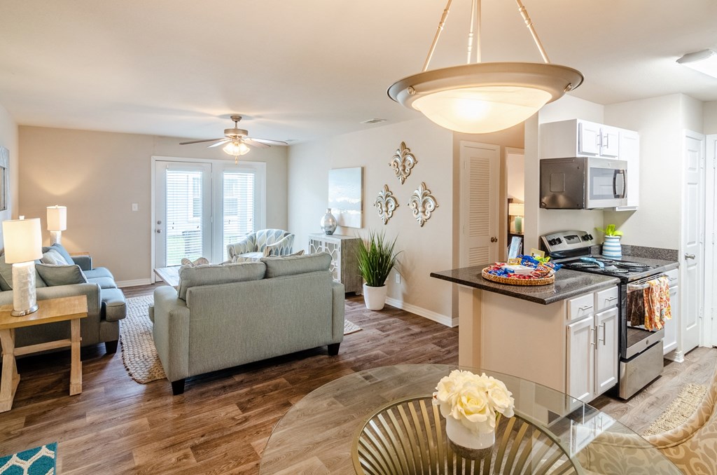 an open floor plan with a kitchen and living room