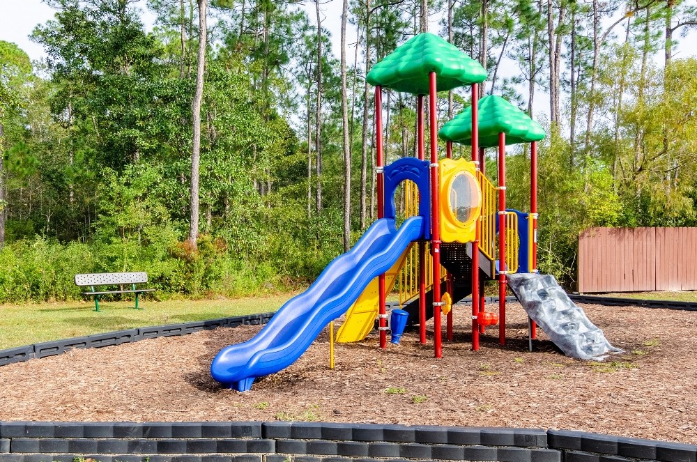 a playground at a park with a slide