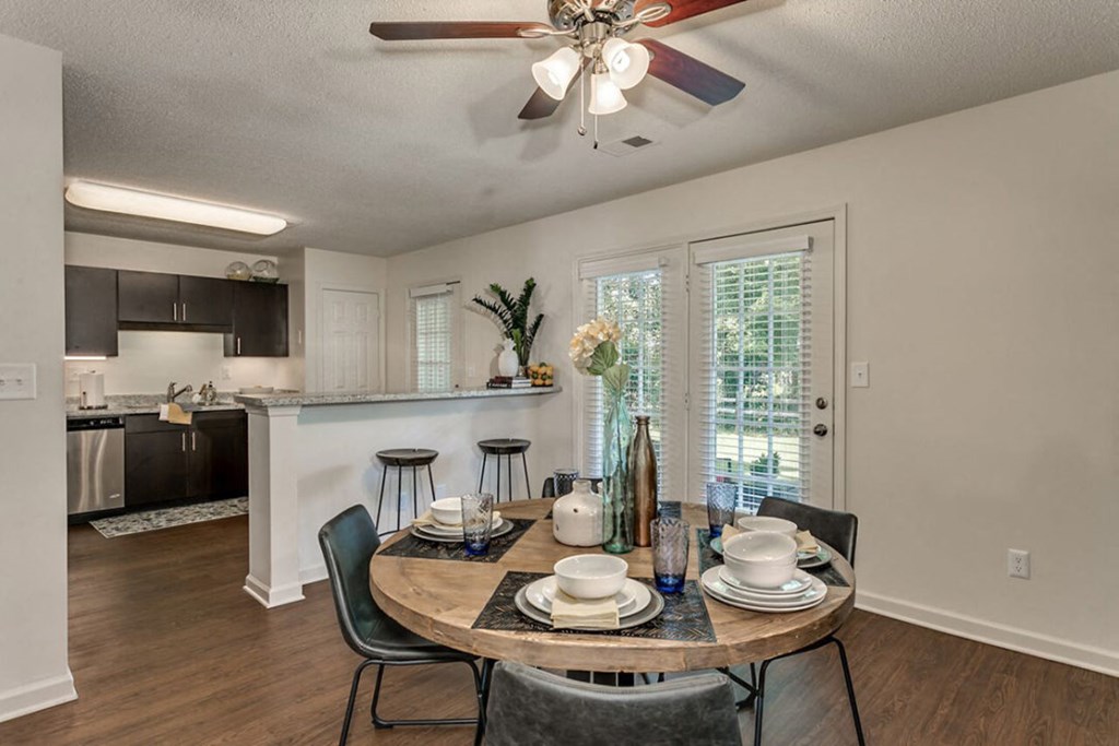 an open kitchen and dining room with a table and chairs