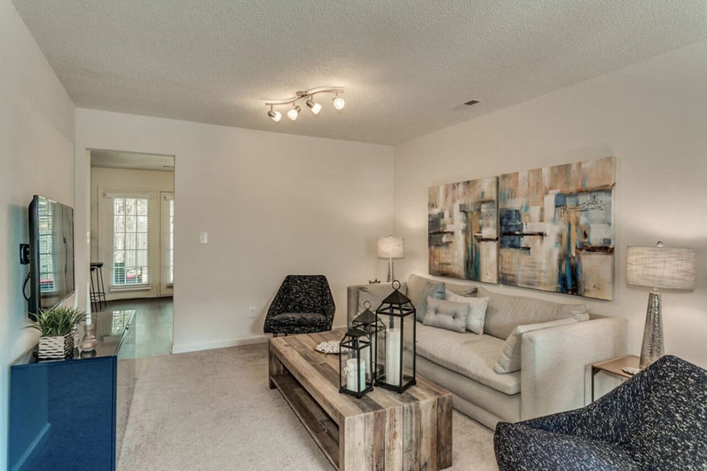 a living room with a couch and a table