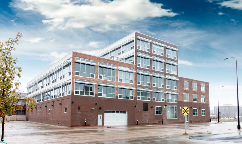 a large brick building with a white garage door