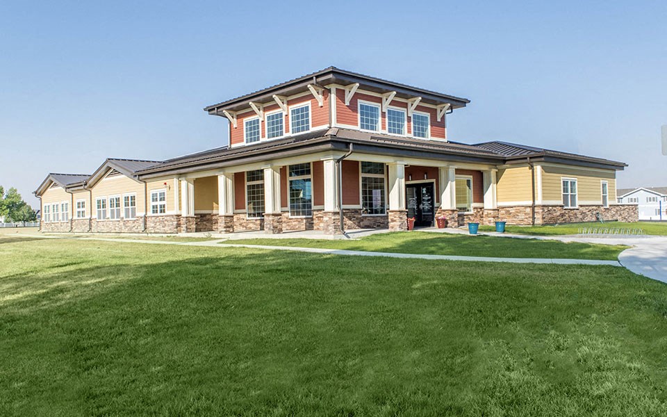 a large house with a lawn in front of it