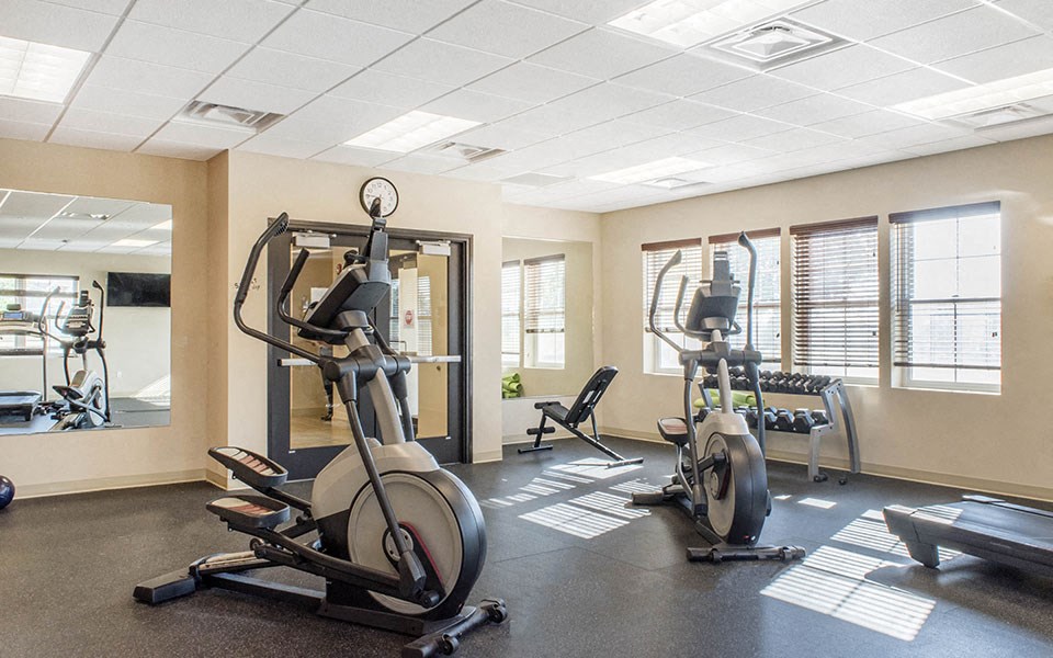 a gym with weights and other exercise equipment