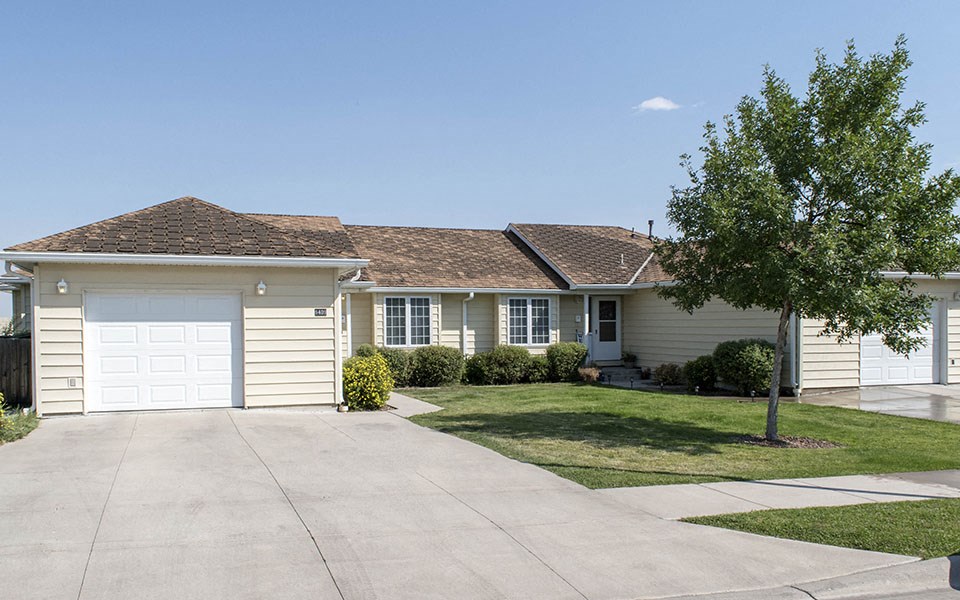 a white house with a white garage door