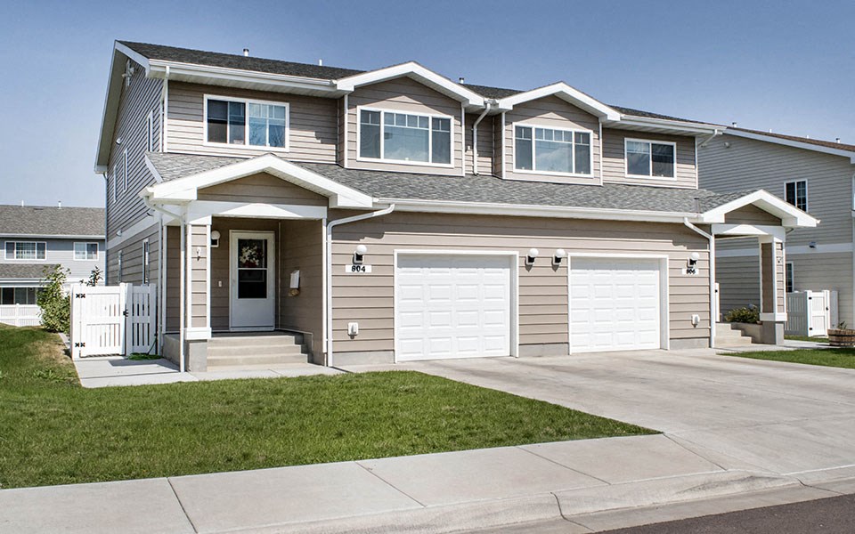 a house with a white garage door in front of it
