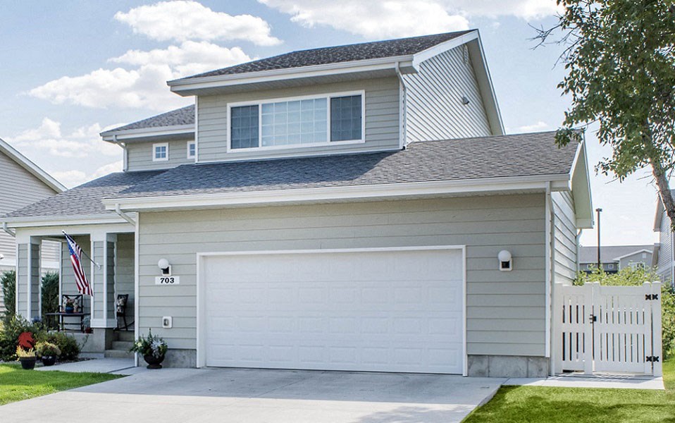 a white house with a white garage door