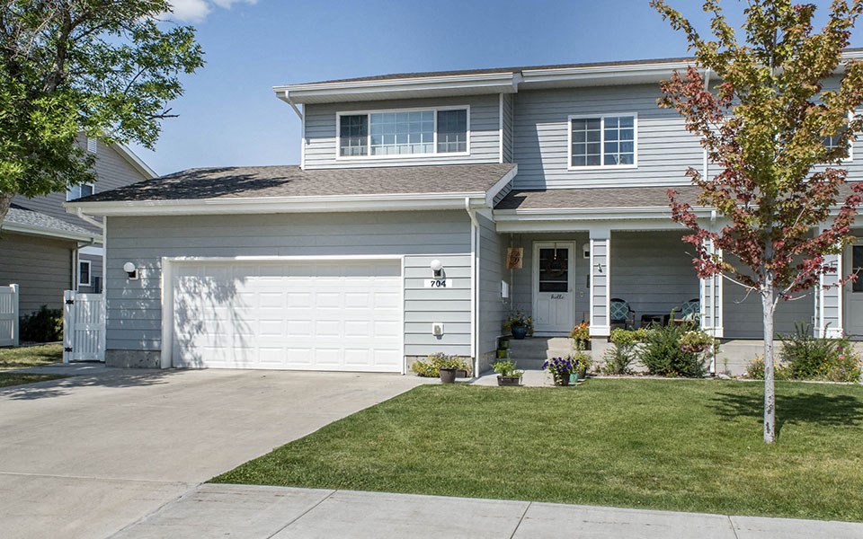 a white house with a white garage door