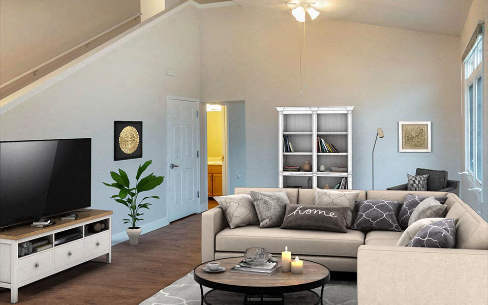 a living room with a couch and a tv