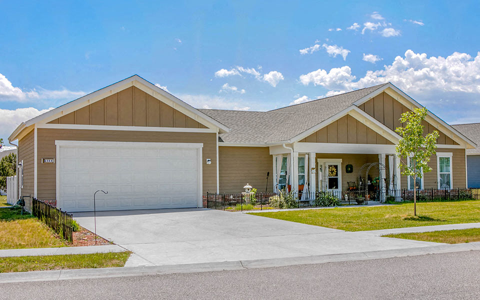 a house with a driveway and a garage door