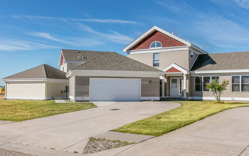 a house with a driveway and a garage door