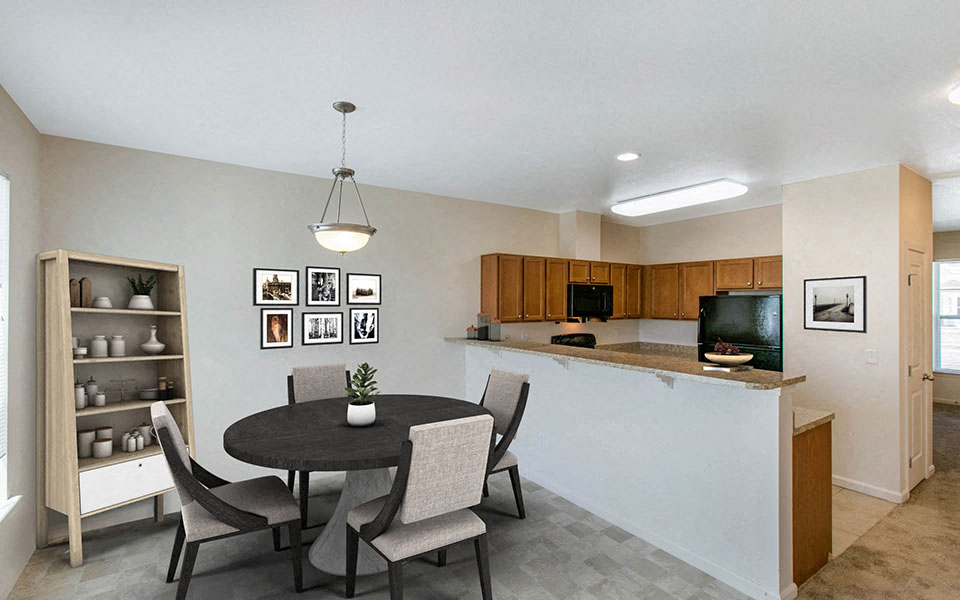 a dining room and kitchen with a table and chairs