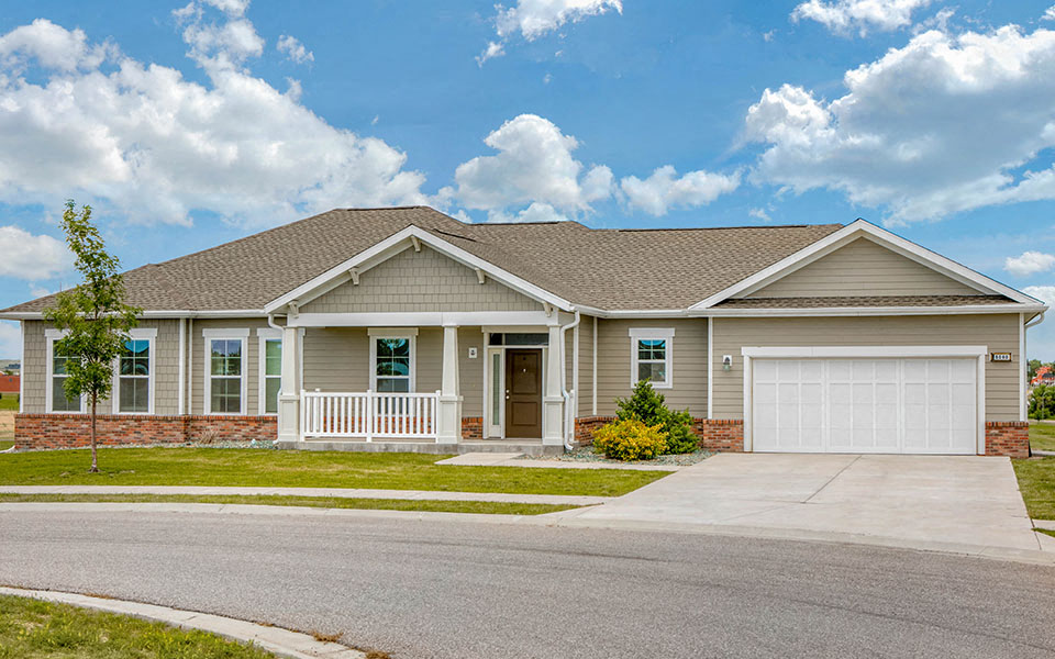 a house with a driveway and a garage door