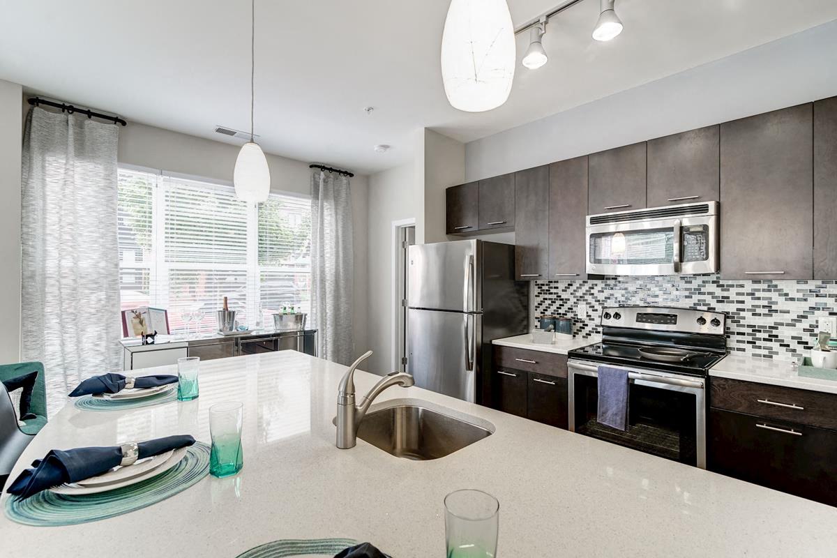 Quartz Countertops & Tile Backsplash in Kitchen