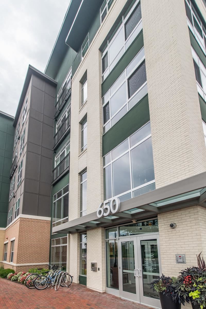a building with a glass door and a sign that reads 60