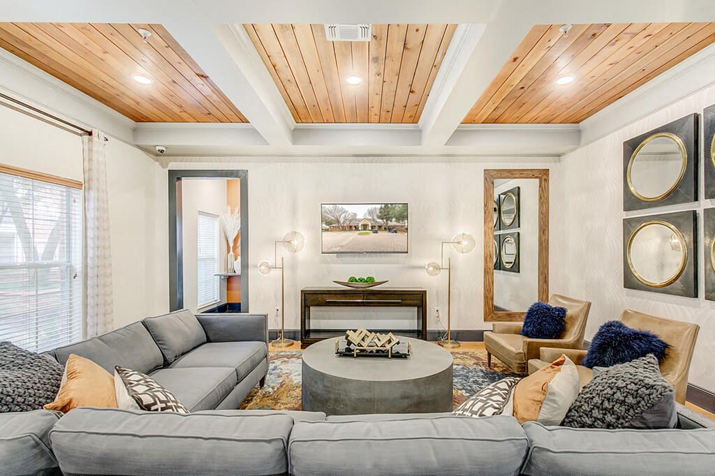 a living room with couches and a table